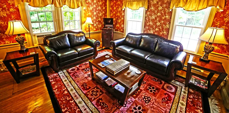 Estate sale living room setup in Marblehead MA showcasing furniture and household contents for appraisal and sale